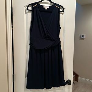 Navy blue sleeveless wraparound Kors dress with gold shoulder embellishment